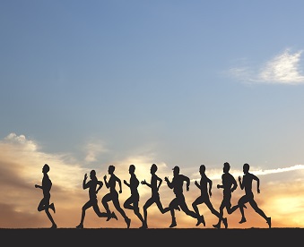 Marathon, black silhouettes of runners on the sunset